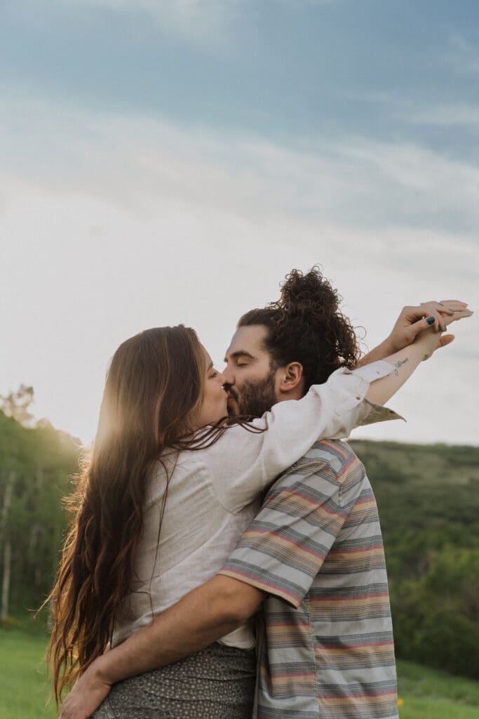 Scenic view of Snowbasin mountain with wildflowers in the foreground during golden hour