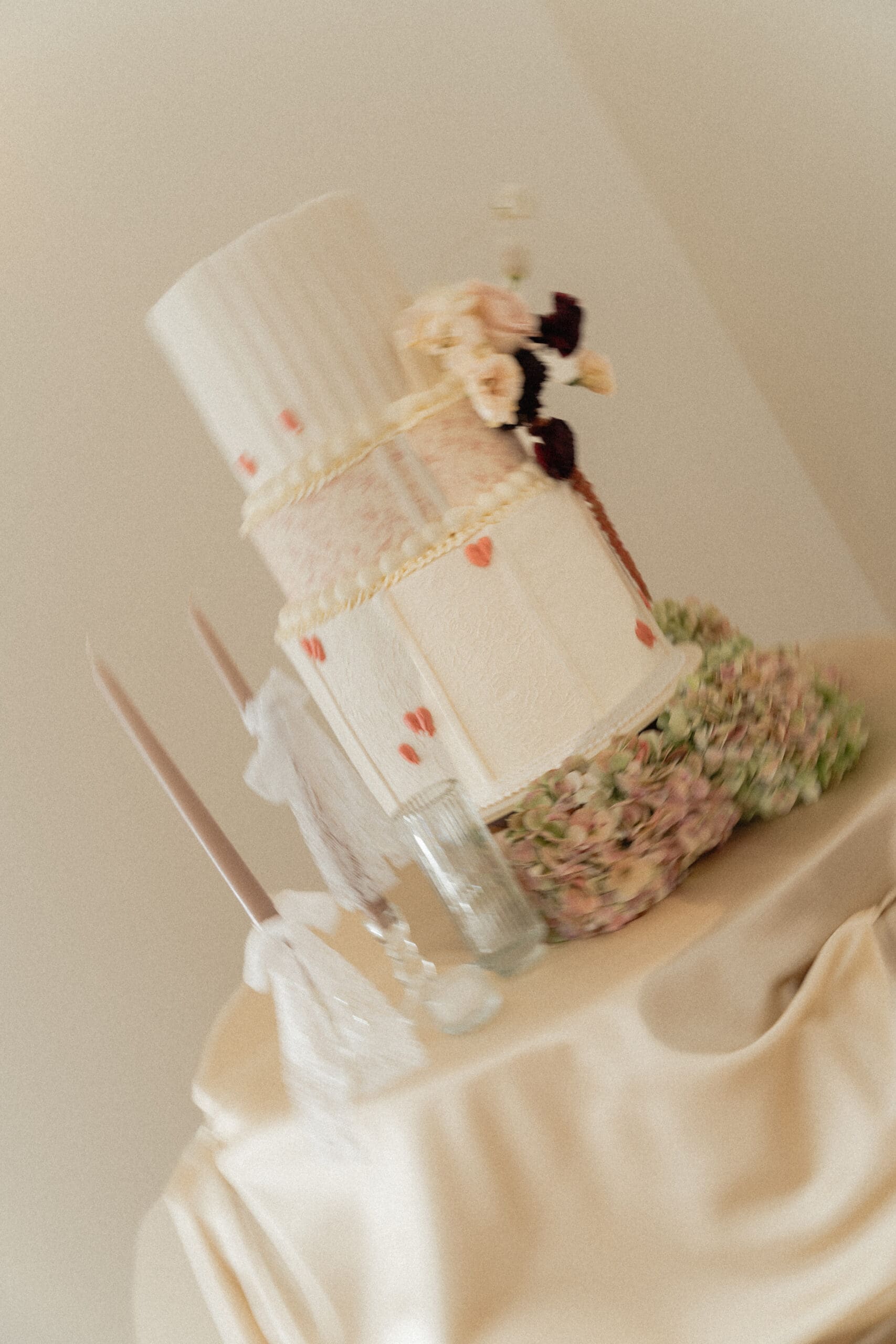 Elegant wedding ceremony setup with a wedding cake at Moments on Main, a beautiful option among wedding venues in Utah County.
