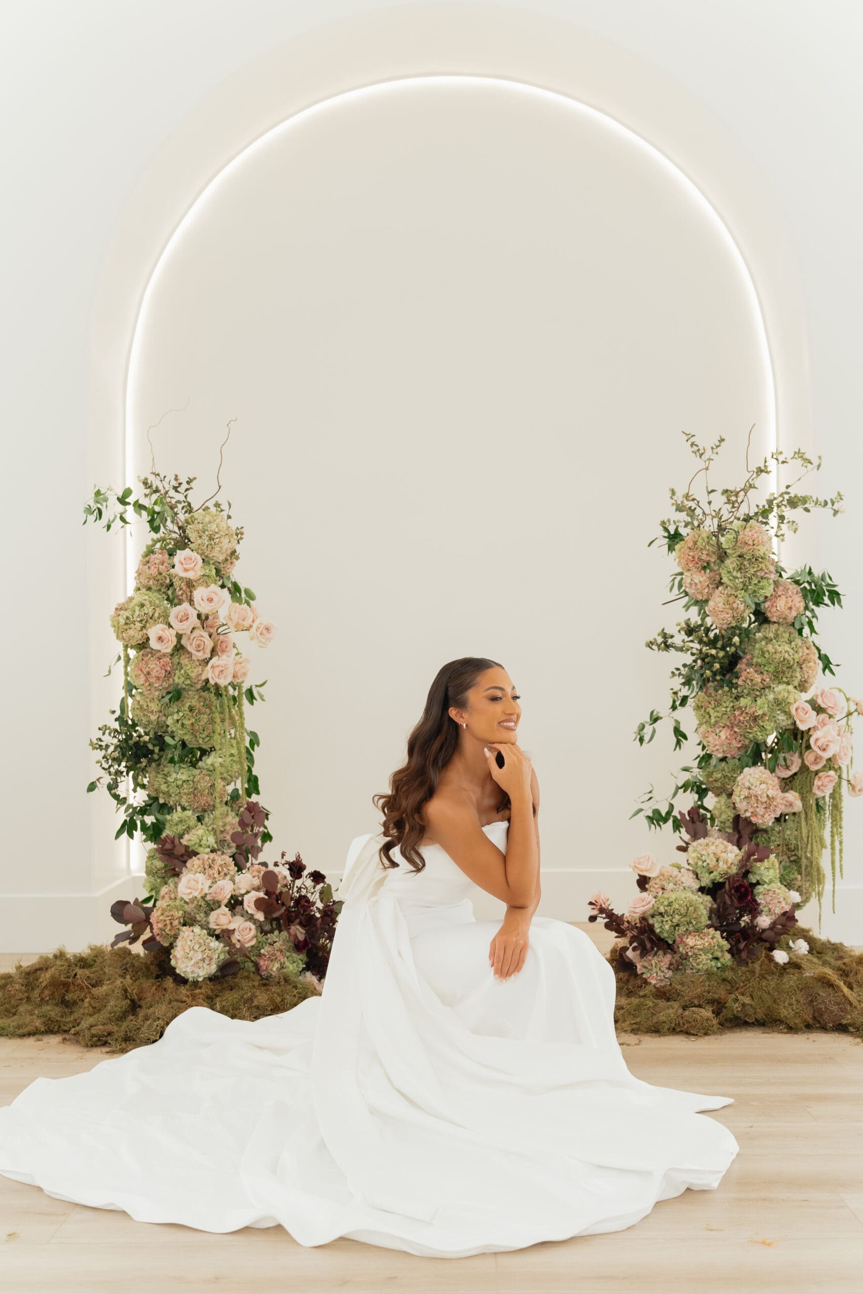 Bride and groom sharing a kiss inside a charming indoor space at one of the top wedding venues in Utah County.