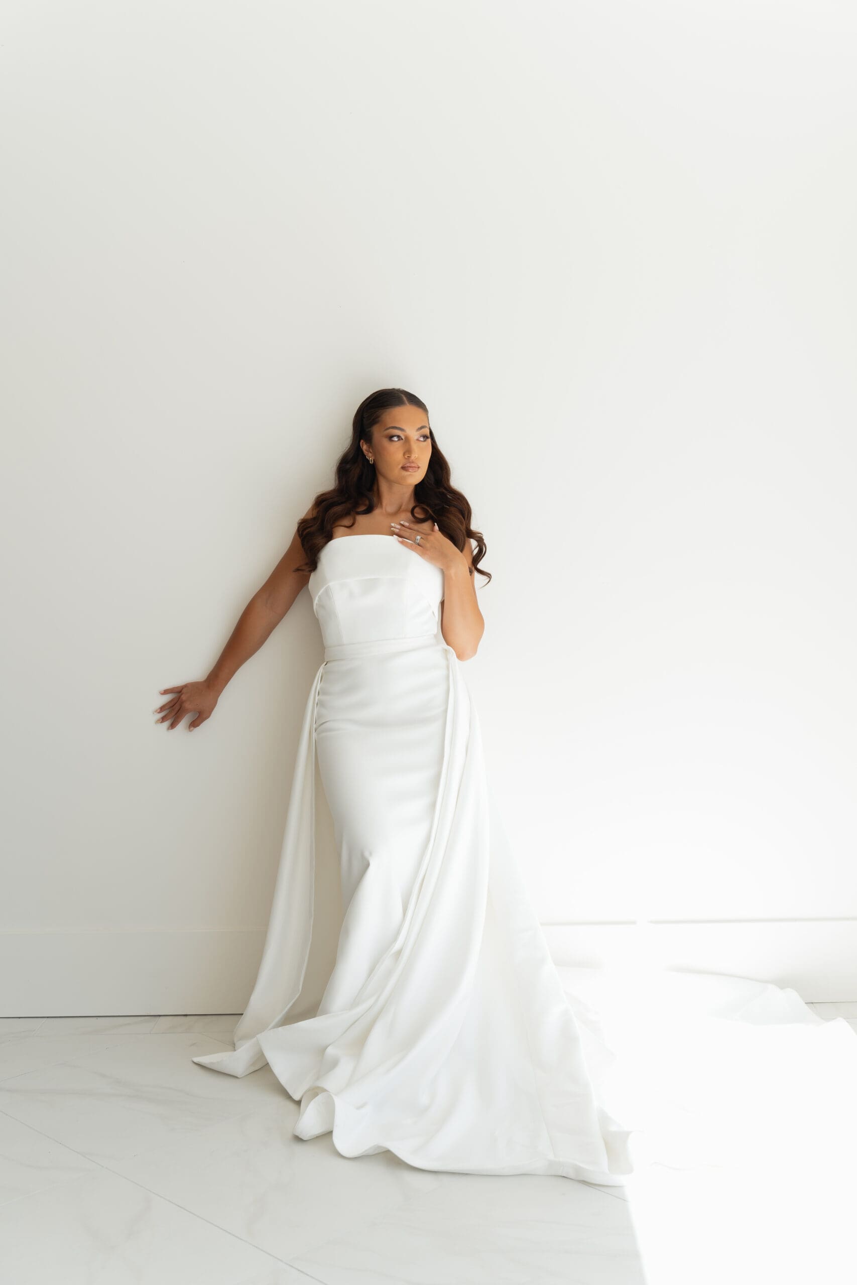 Bride standing in a beautifully lit indoor space at one of the most elegant wedding venues in Utah County.

