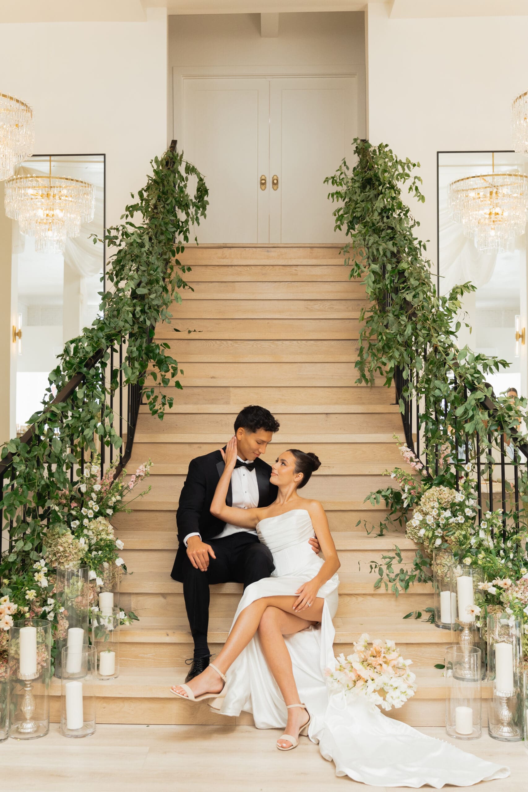 Bride and groom sharing a kiss inside a charming indoor space at one of the top wedding venues in Utah County.